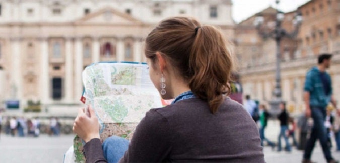 Student holding a map