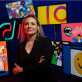 Sophia Choukas-Bradley posing in front of colorful artwork.