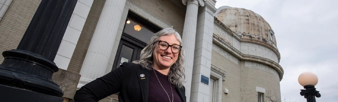 Rachel Bezanson, assistant professor in the Department of Physics and Astronomy, photographed outside the Allegheny Observatory