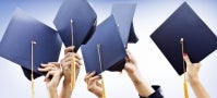 hands in the air holding mortarboards, raised in celebration hands in the air holding mortarboards, raised in celebration