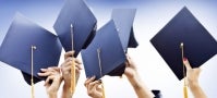 hands holding mortarboards, raised in celebration hands holding mortarboards, raised in celebration
