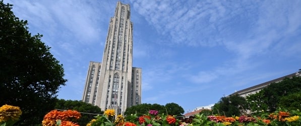 Image of Cathedral of Learning with Zinnias in the foreground
