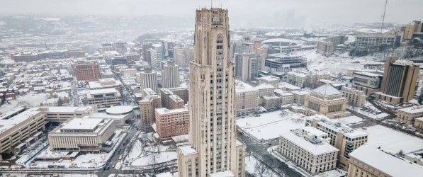 Image of a snowy Pitt Campus with the Cathedral of Learning in the center of the frame