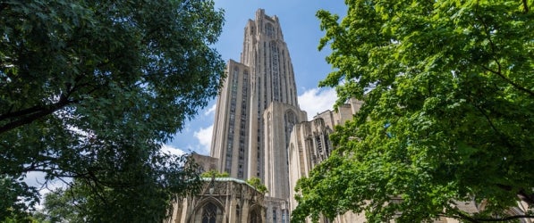 Cathedral of Learning through trees and foliage