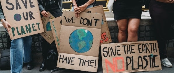 environmental activists and their signs