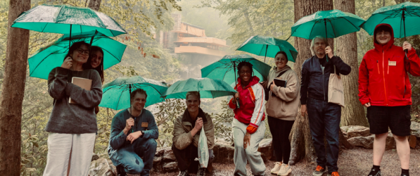 The Summer Design Studio class with Professors Drew Armstrong and Gabe Nolle on the Fallingwater Loop Trail with Fallingwater in the background