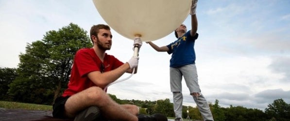 researchers and weather balloon