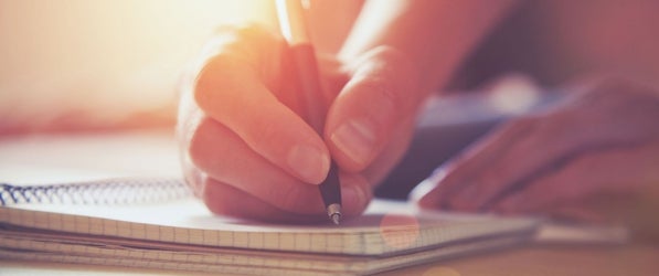 Writing in notebook Writing in notebook